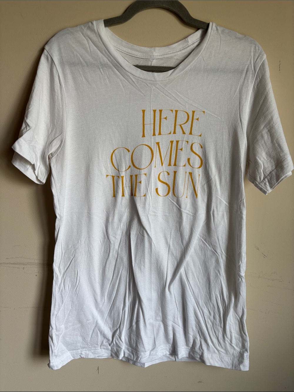 White Graphic Tee with Gold 'Here Comes The Sun' Print